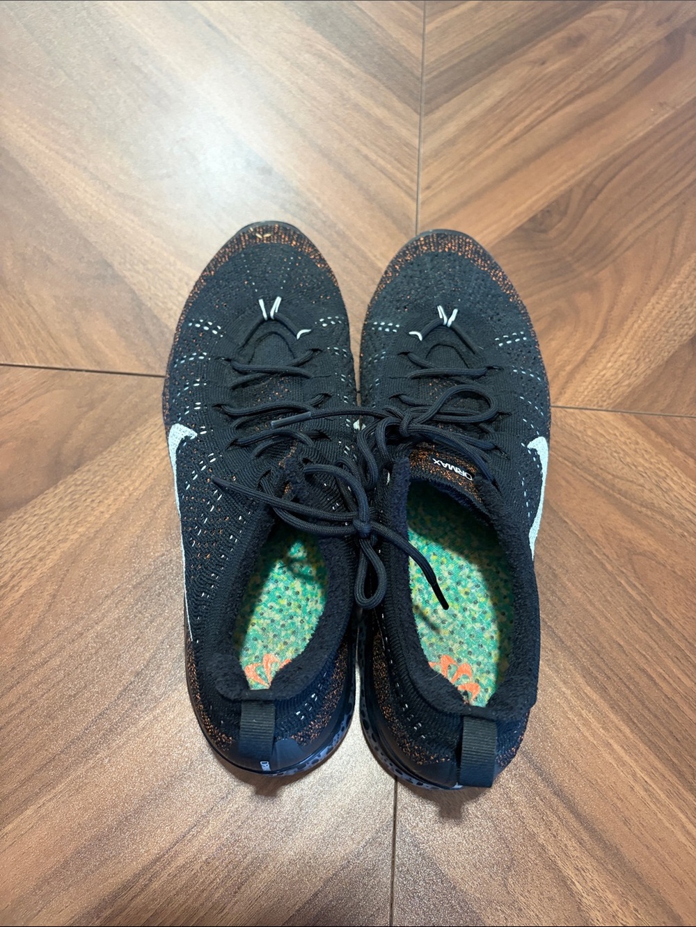 Nike Black Flyknit Running Shoes with Orange Detail